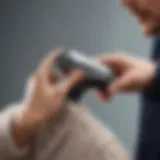 Close-up of an electric sweater shaver in action, removing pilling from a knit sweater