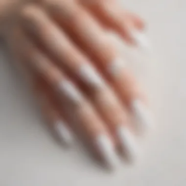 An array of white long press on nails in various shapes and lengths.