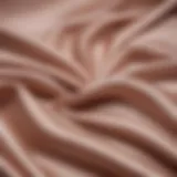 Close-up view of luxurious sheer satin fabric showcasing its smooth texture and sheen